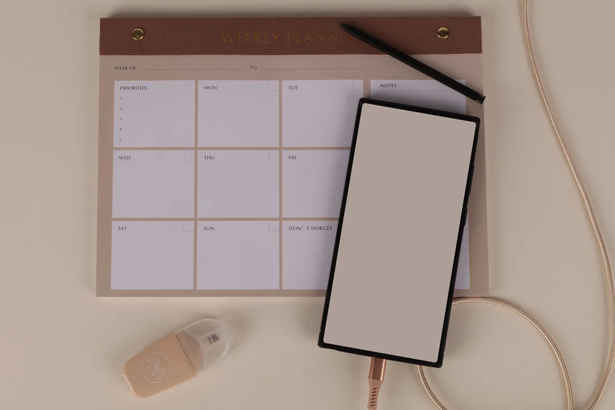 Minimal weekly planner and stationery for a cleaning schedule