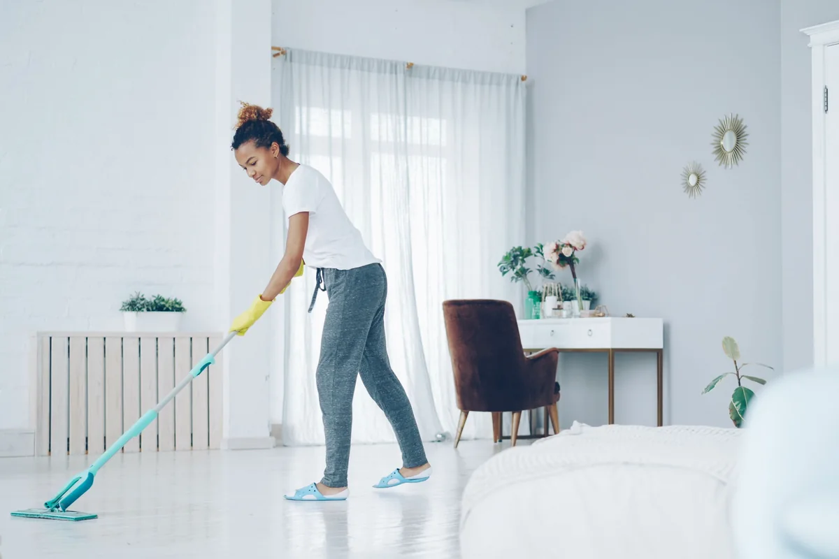 Bright modern home being mopped during spring cleaning